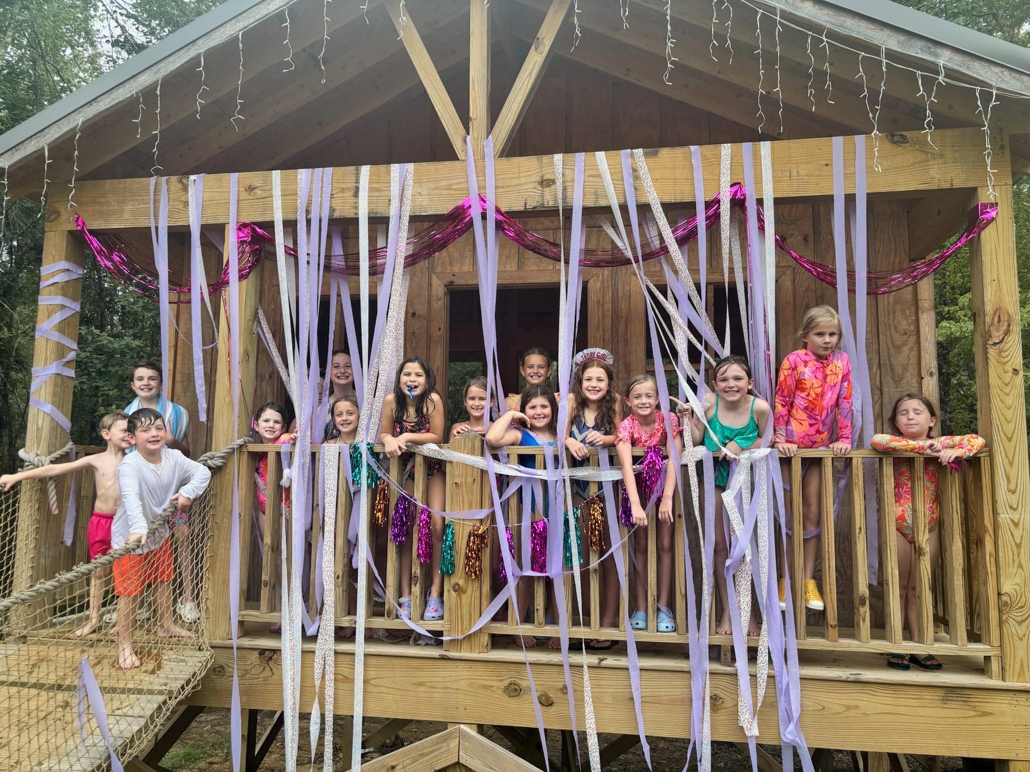 Large group of children on the decorated barn porch