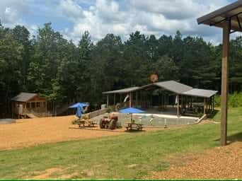 Blue splash pad with shade structures and seating